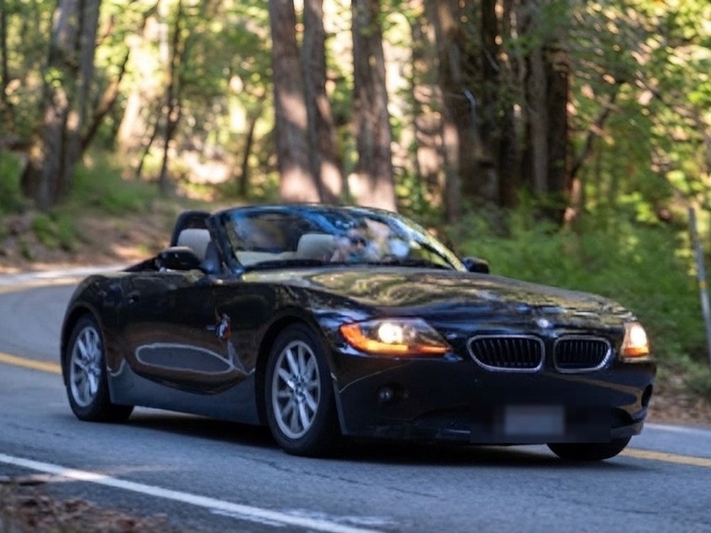 Daniel driving a BMW Z4 through the Santa Cruz Mountains